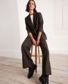 Wide Leg Pleated Wool Trousers, Ivy Green | Really Wild | Model Front Sitting