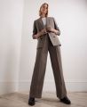 Wide Leg Pleated Wool Trousers, Taupe | Really Wild | Model Image One