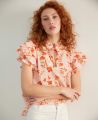 Frill Tie Neck Top, Coral Pink | Really Wild Clothing | Model Close up